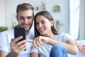 a couple looking for a house online